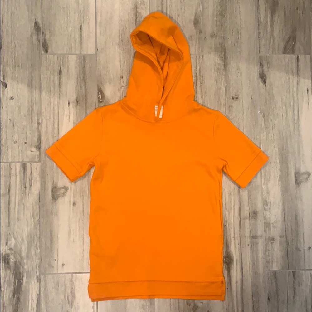 Orange youth top with hood and pockets